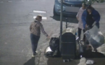 CCTV image of two people dumping rubbish around a public bin