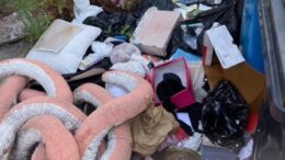 piles of rubbish in a street