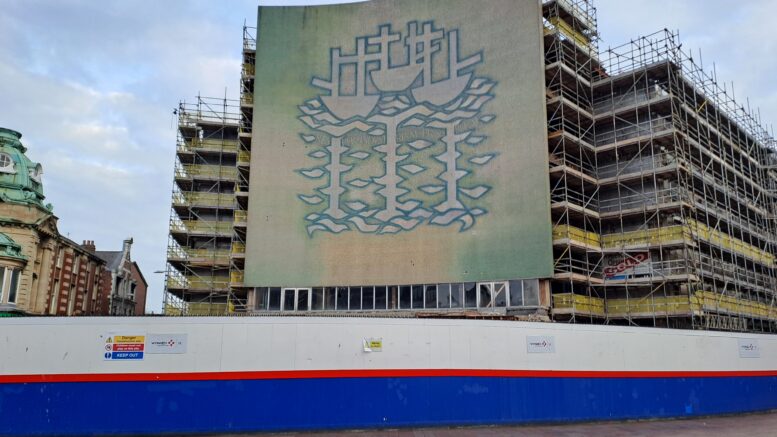 Scaffolding being removed from former BHS building