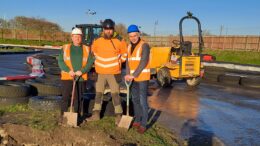 Hull Adventure Centre manager John Haines, High-Low Ropes Course Consulting Ltd CEO Ali Glendinning and Hull City Council's portfolio holder for regeneration and housing Cllr Paul Drake-Davis in hard hats and hi-viz with shovels.