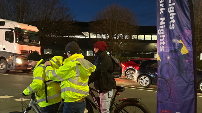 Staff from Hull City Council fitting bike lights and hi-vis to cyclists on Spring Bank