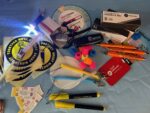 the collection of safety items contained in the goody bag, laid out on a table. The list is included in this article.