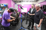 Councillor Mark Ieronimo and Fergal McCullough discuss cycle maintenance with one of R-evolution’s trained mechanics at the Trinity Market Cycle Hub
