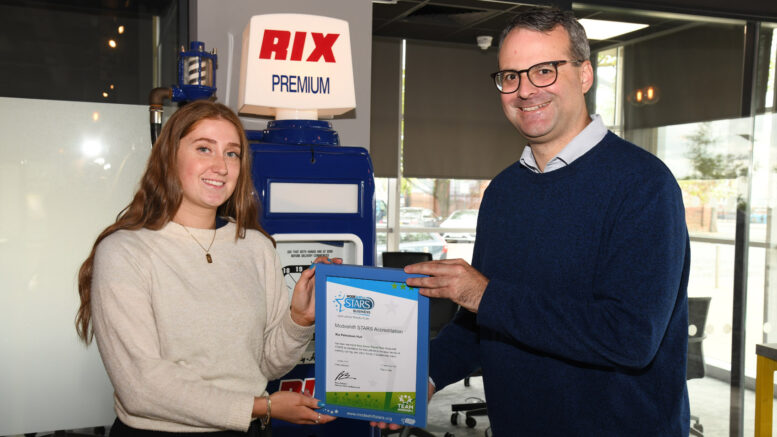 Councillor Mark Ieronimo, cabinet portfolio holder for transportation, roads and highways from Hull City Council, presents the Rix Group’s certificate to Cerys Davies, business analyst