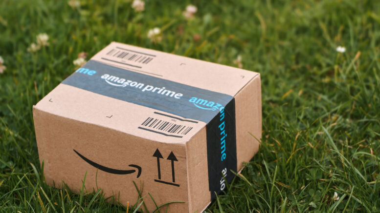Amazon delivery box on grass.