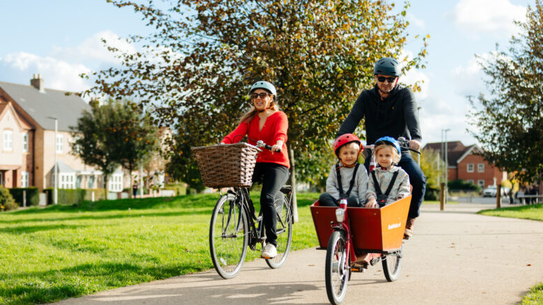 A family cycling in Kingswood in Hull