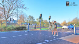 People and cyclists crossing the road to Ennerdale Leisure Centre