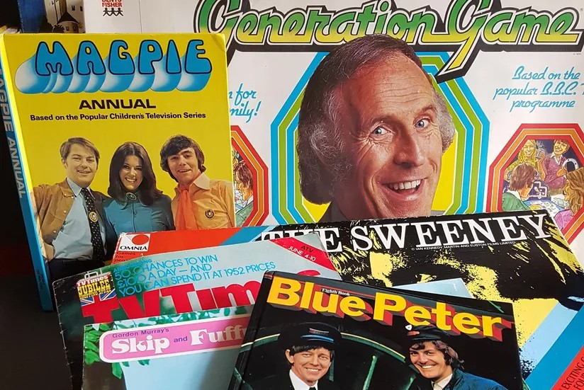 An image of a number of games and books from the 1970s including Blue Peter and the Generation Game