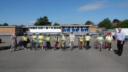 Children at Rokeby Park Primary School during a Bikeability training session with Councillor Tracey Henry (left) and Councillor Mark Ieronimo (right)