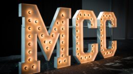 Large light up letters spelling MCC