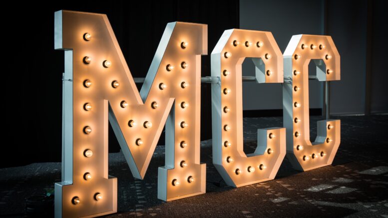 Large light up letters spelling MCC