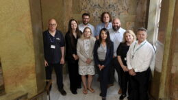 Multiply partners on internal guildhall staircase.