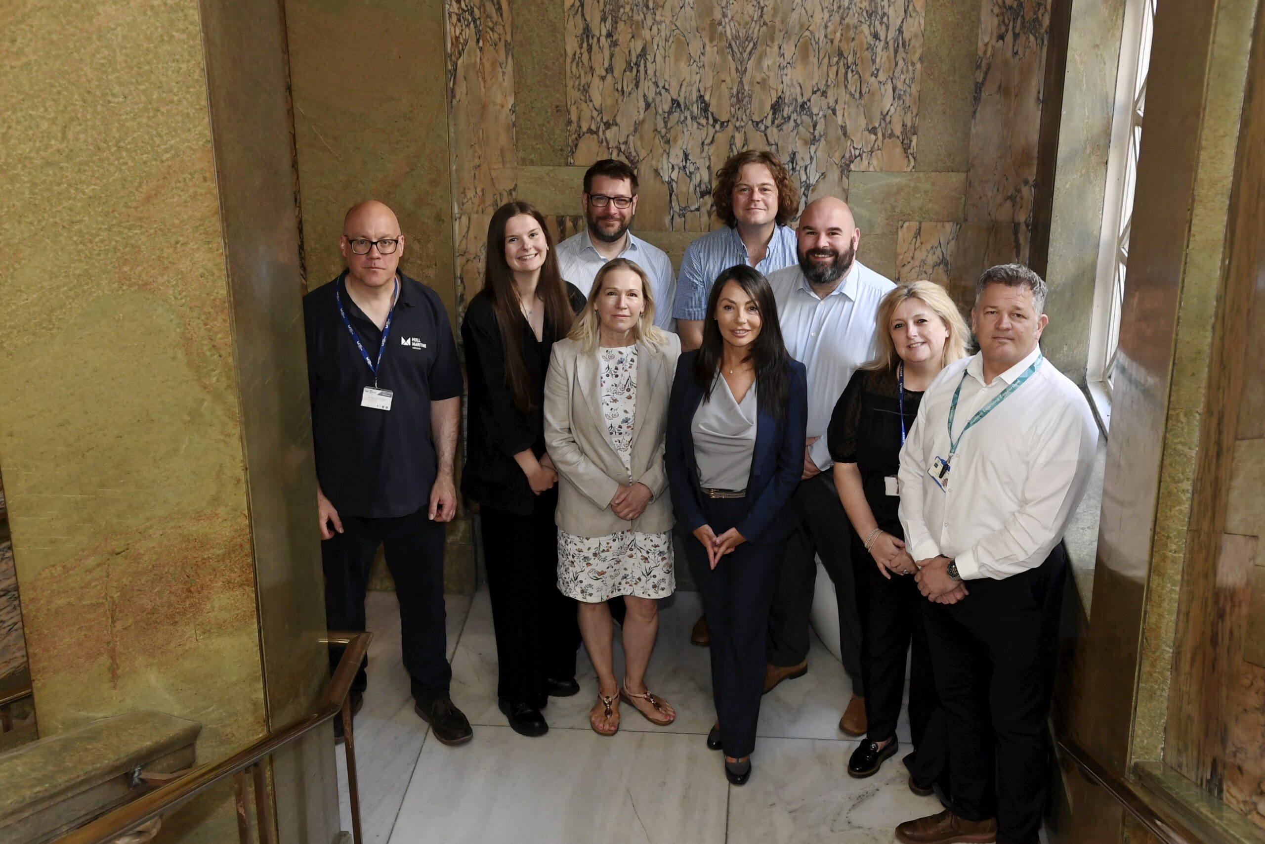 Multiply partners on internal guildhall staircase.