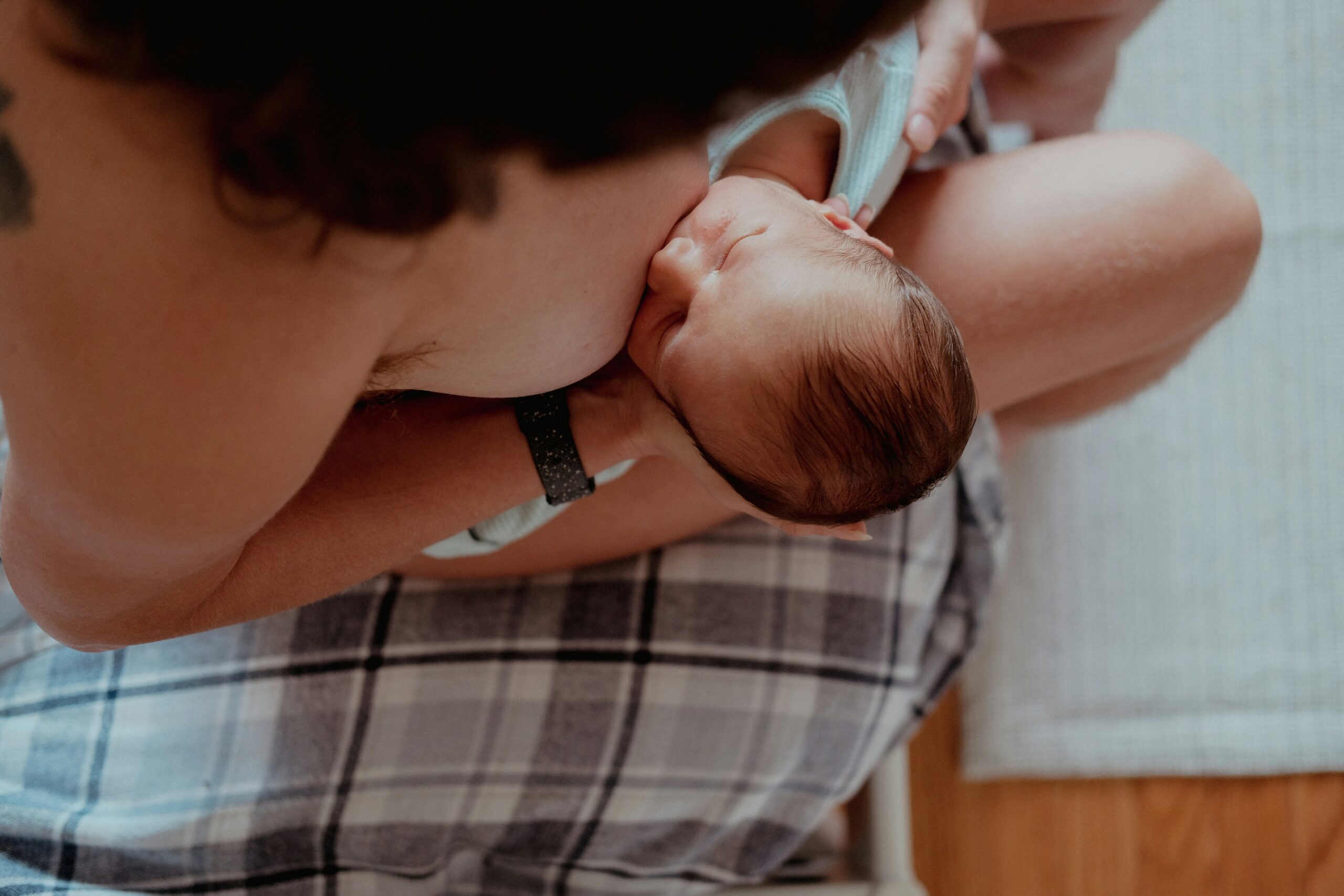 A woman breastfeeds her baby