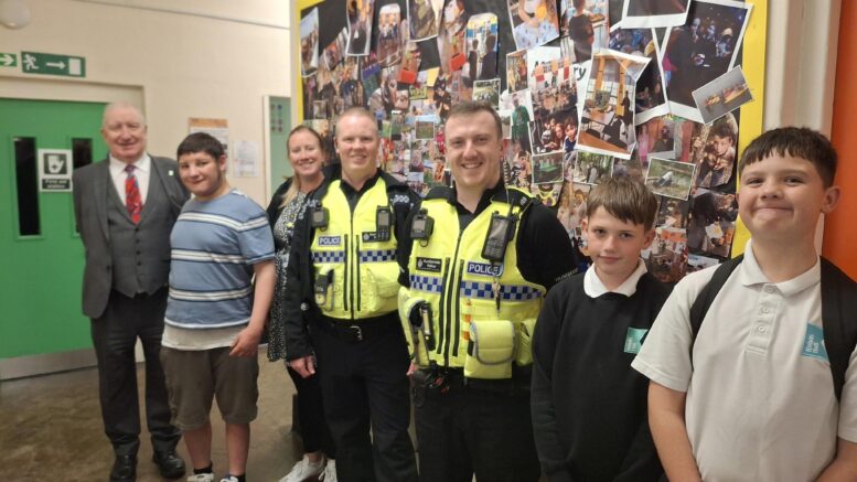 Councillor Mark Collinson, children and members of Humberside Police at Route One Youth Centre.