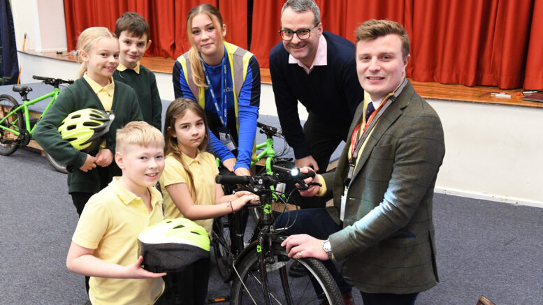 Councillor Mark Ieronimo (second right) and Deputy Police & Crime Commissioner, Leo Hammond (right), with children from Priory Primary School