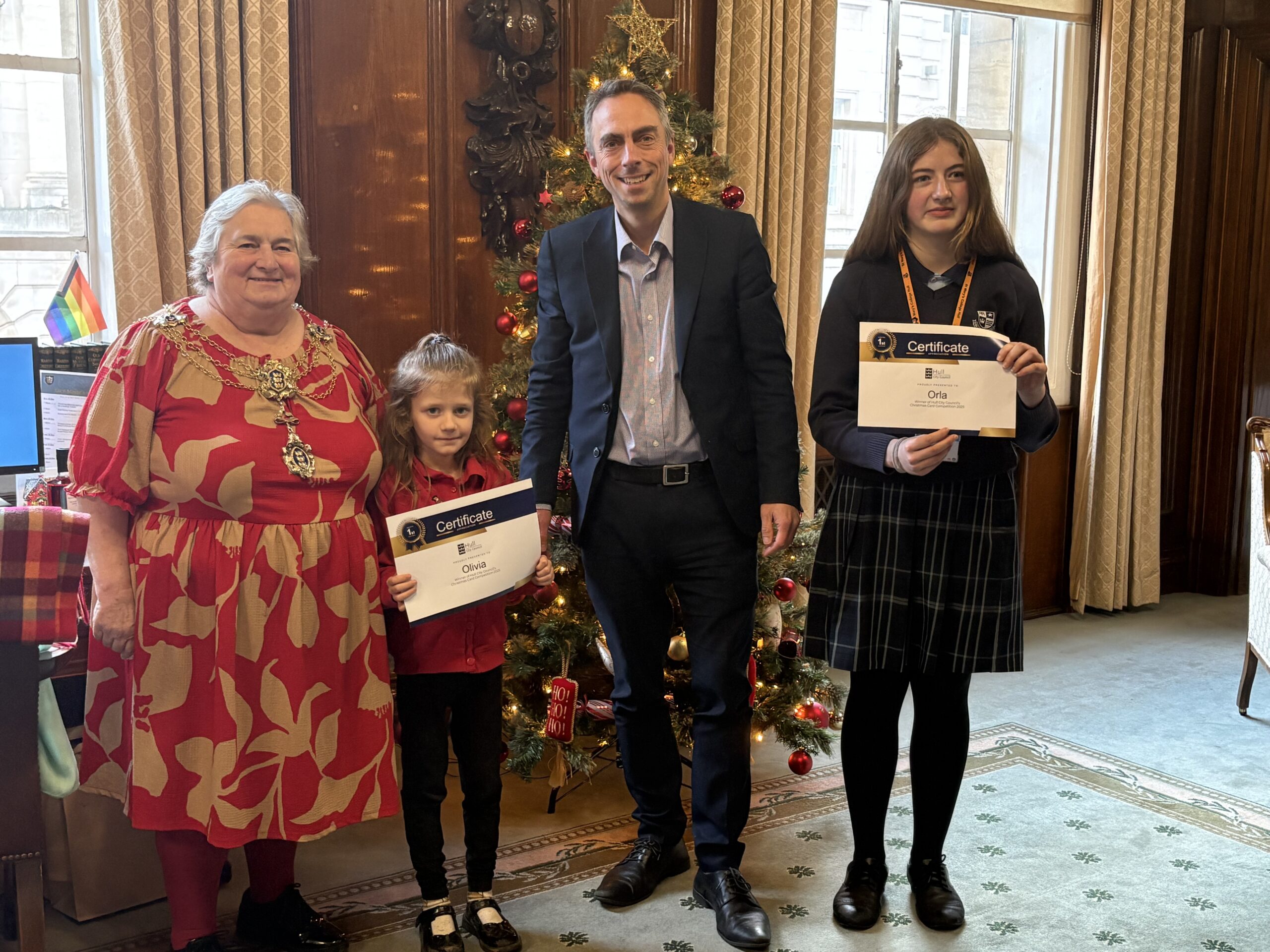 Lord Mayor, Councillor Cheryl Paine, Councillor Mike Ross and the winners of the 2025 Christmas card competition