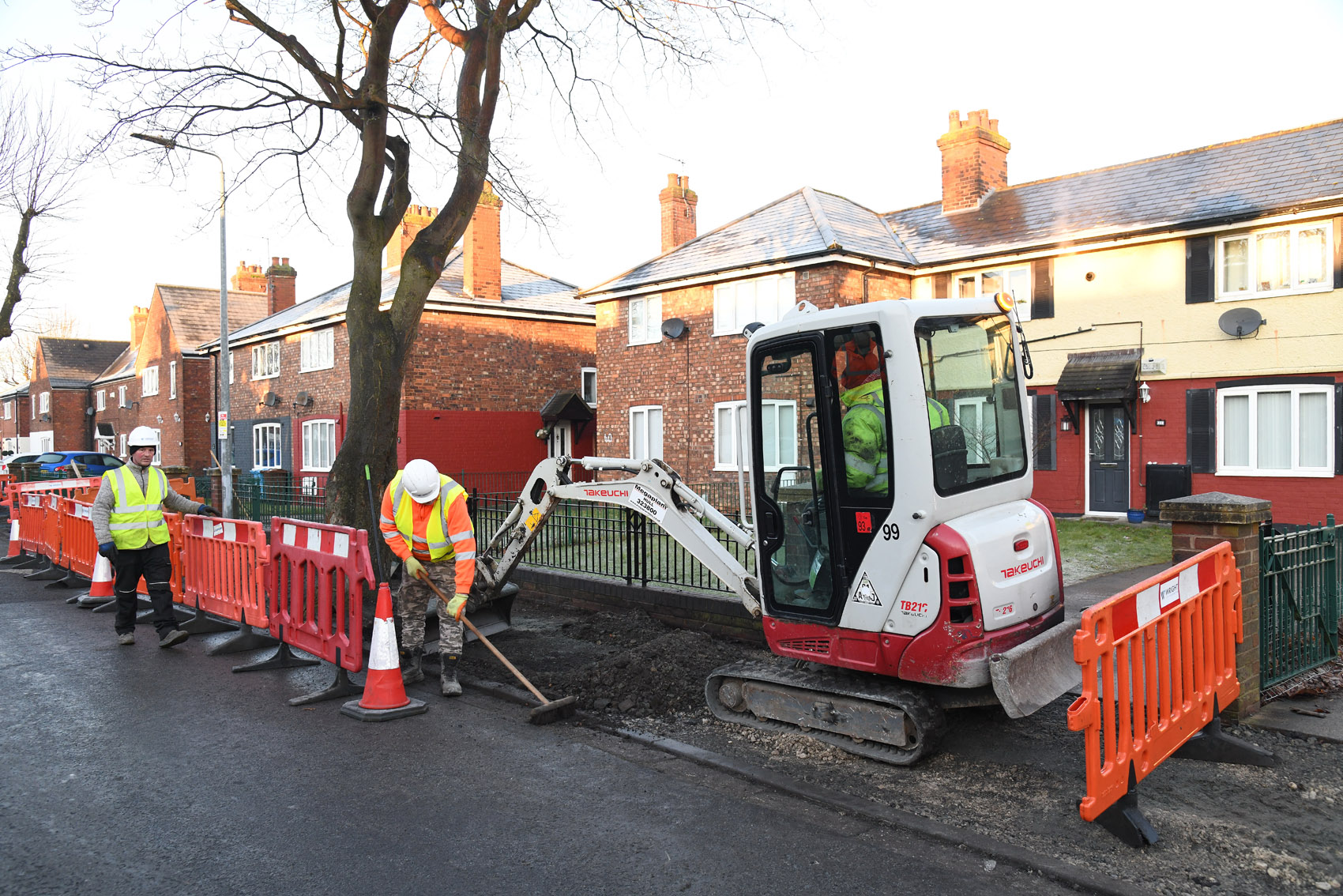Highway workers repairing the footpaths in River Grove, Hull.