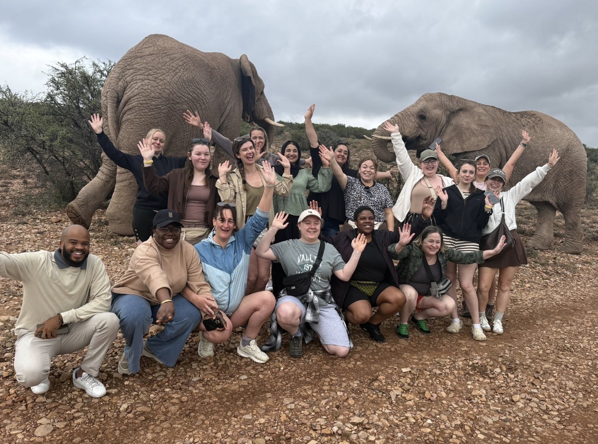 Early Years learners during their trip to South Africa pictured in front of two elephants.