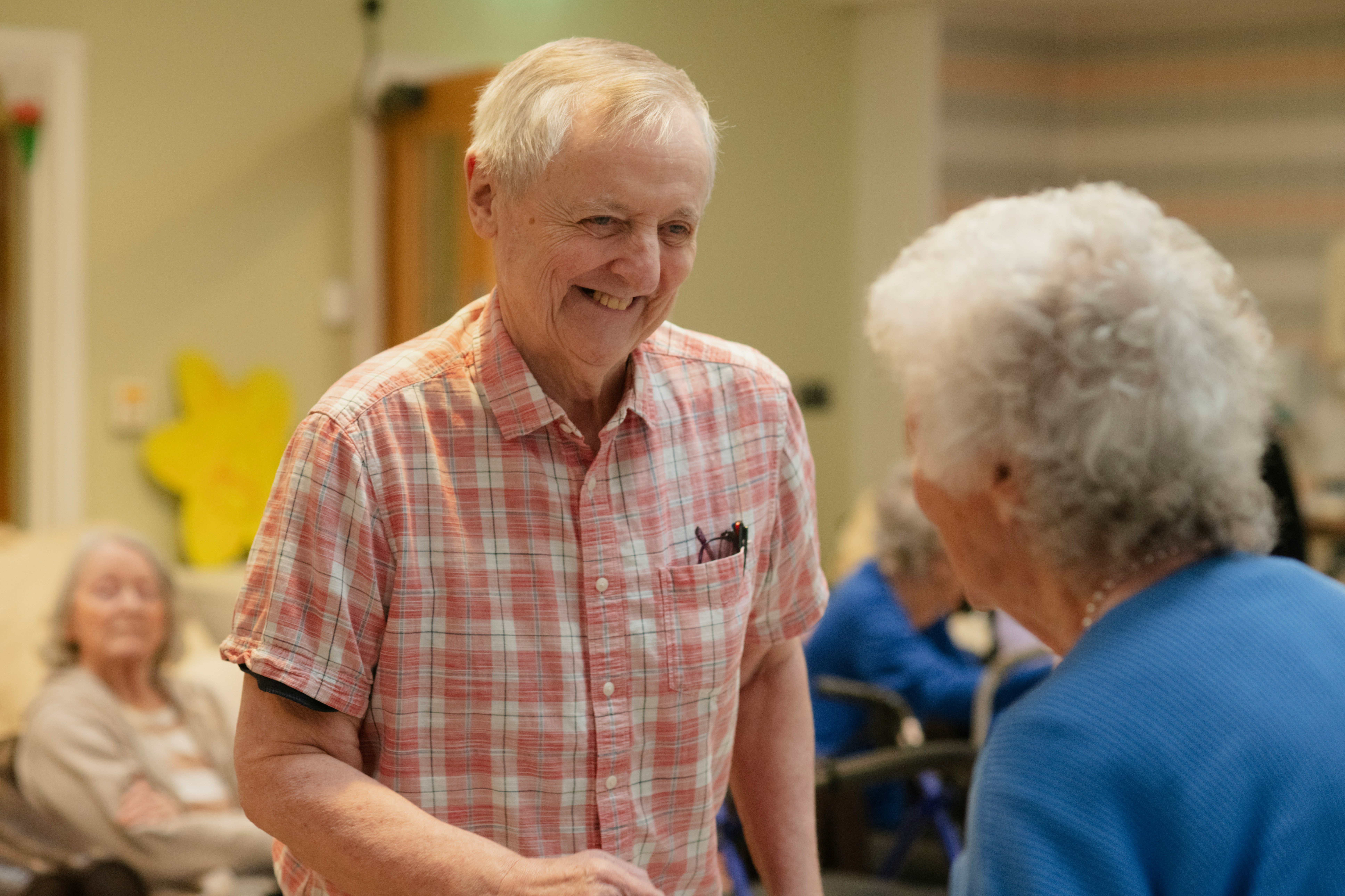 Old man smiling at old woman
