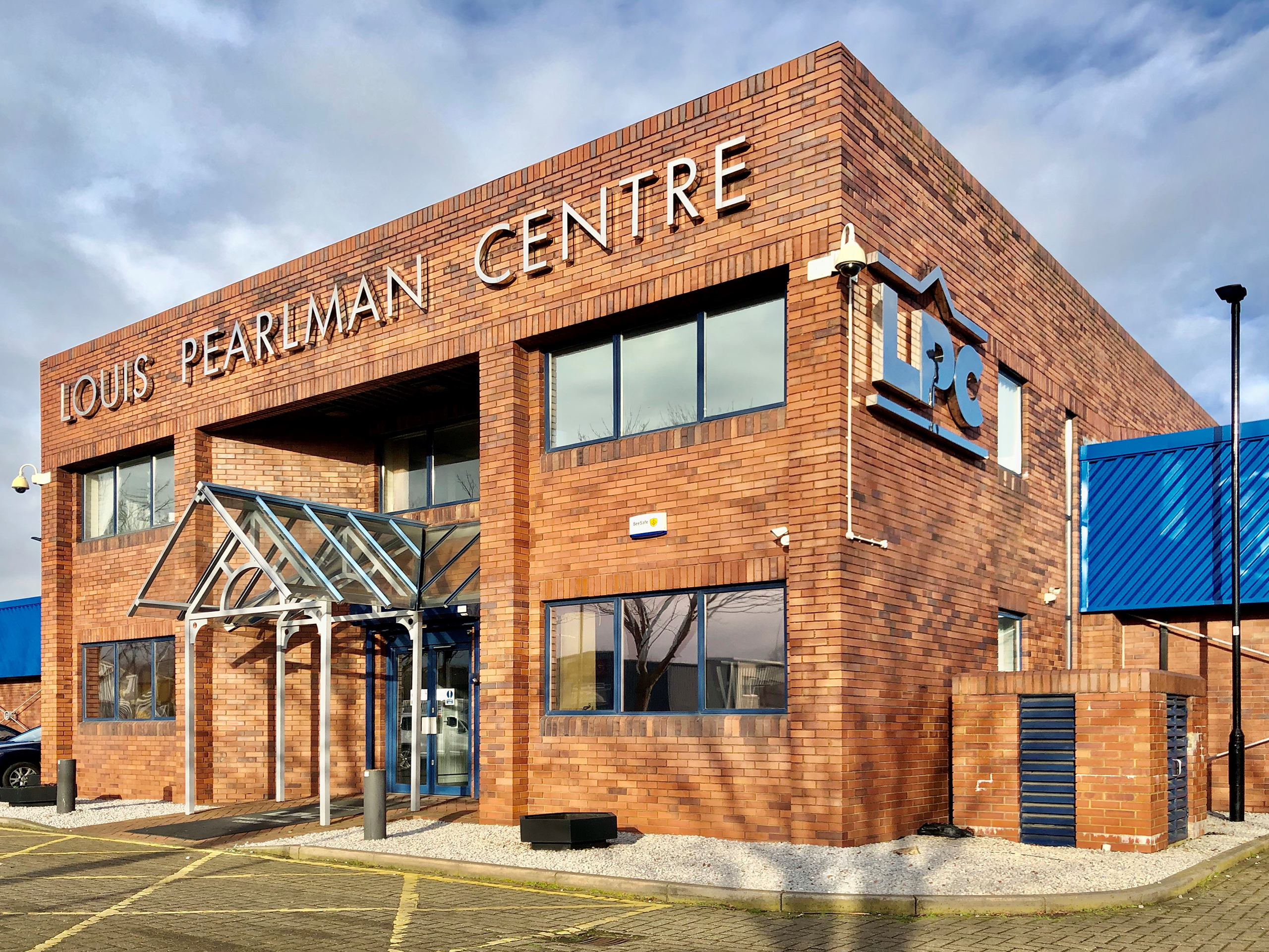 An image of a red brick building with Louis Pearlman Centre written on it