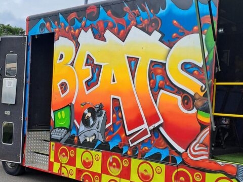 View article Young rappers catch the Beats Bus