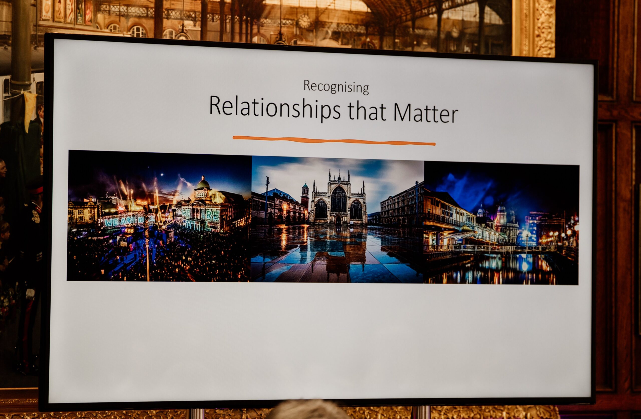 A close-up on the presentation screen for Relationships That Matter's celebratory event.