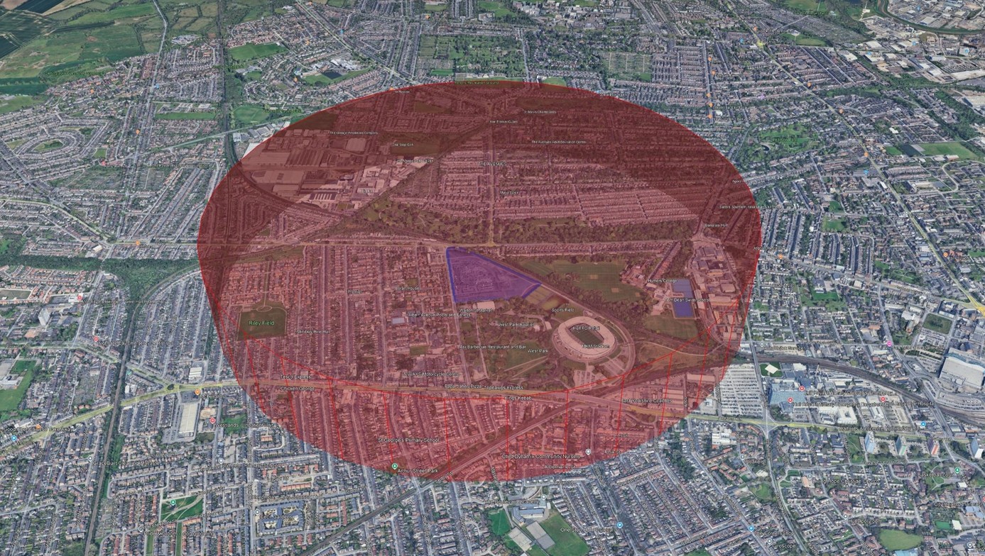 A satellite map of a built up area with a semi transparent red circle covering the centre