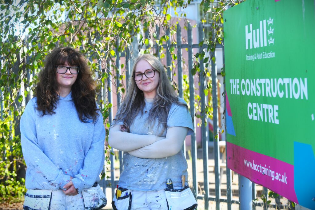 Daisy Milner and Jazzmin Smith outside Hull Training and Adult Education's Construction Centre.