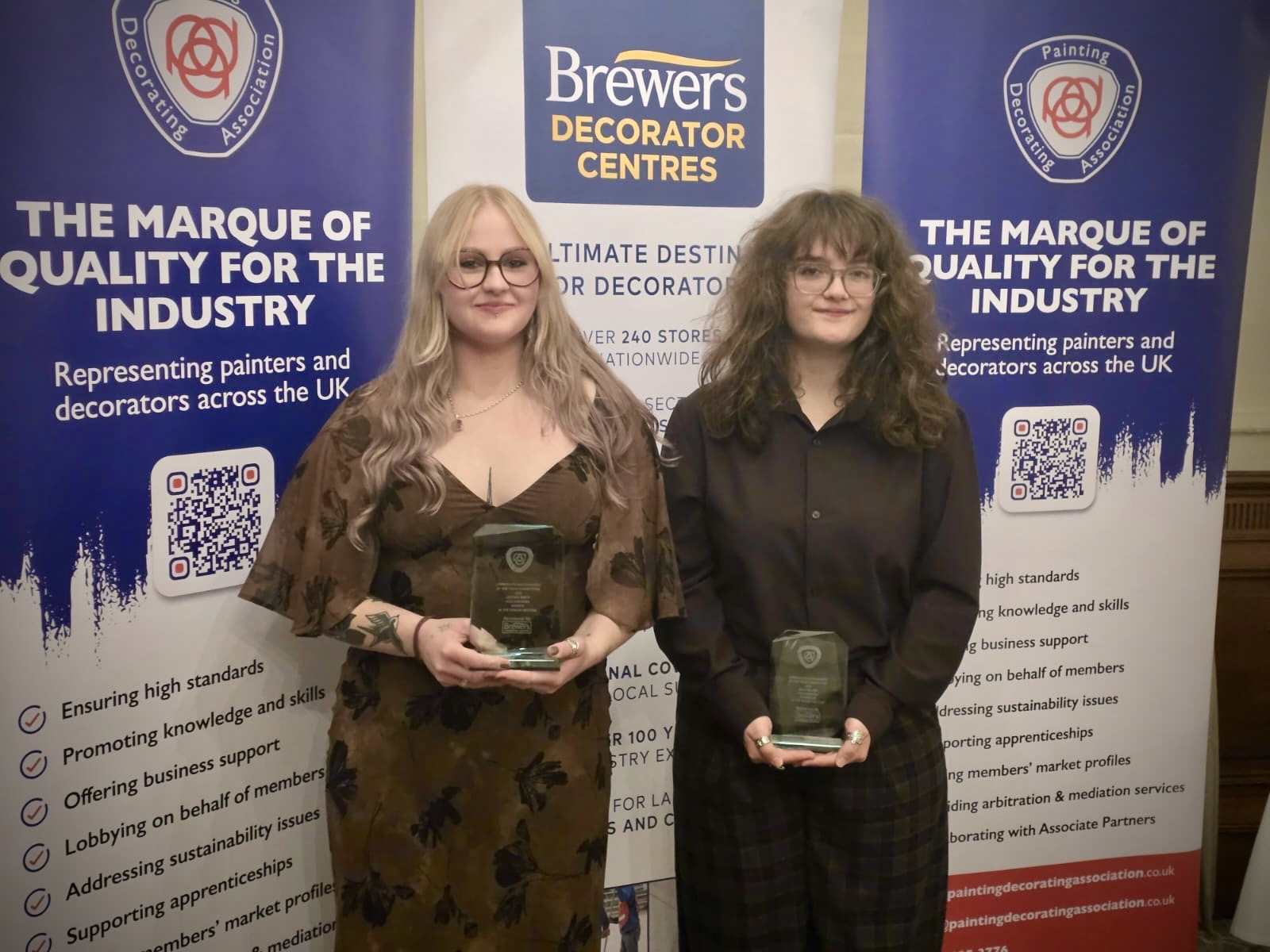 2026 Apprentice Paperhanger of the Year winner Jazzmin Smith (left) with runner-up Daisy Milner, both of Hull Training and Adult Education, holding their awards.